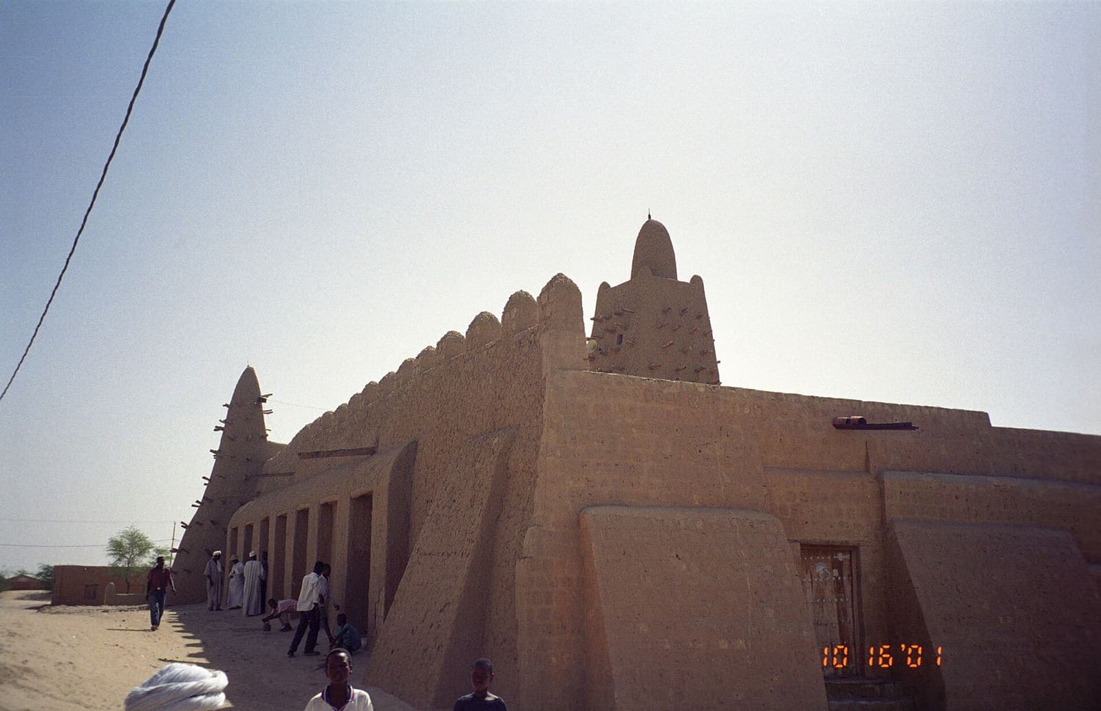 The mud-brick walls and wooden beams of the Djinguereber Mosque.