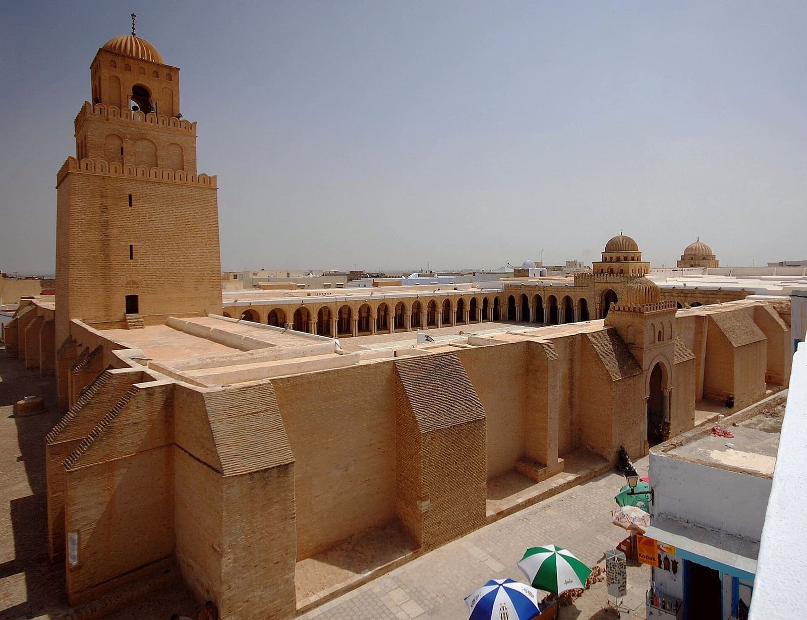 The wide courtyard and square minaret of the Great Mosque of Kairouan.