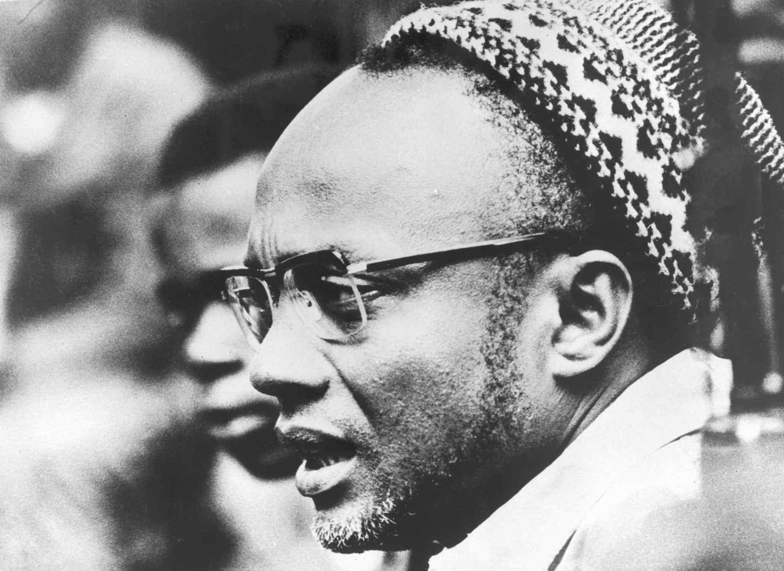 A portrait of Amílcar Cabral wearing a traditional skullcap.